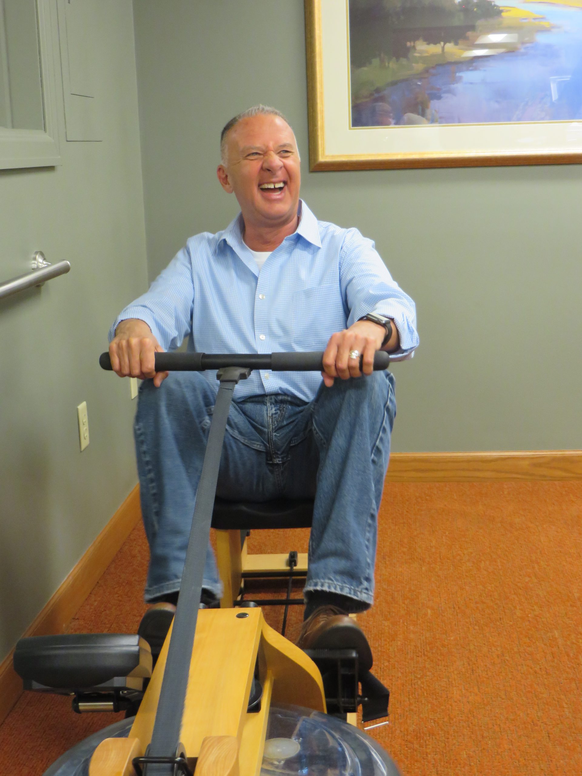 John tries out some equipment in our fitness room.